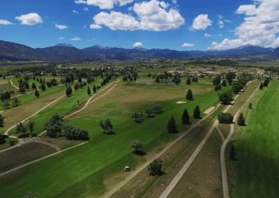 Aerial drone view of the range at the Salida Golf Course peak of summer with Collegiate Peaks Mountain Range views in the background